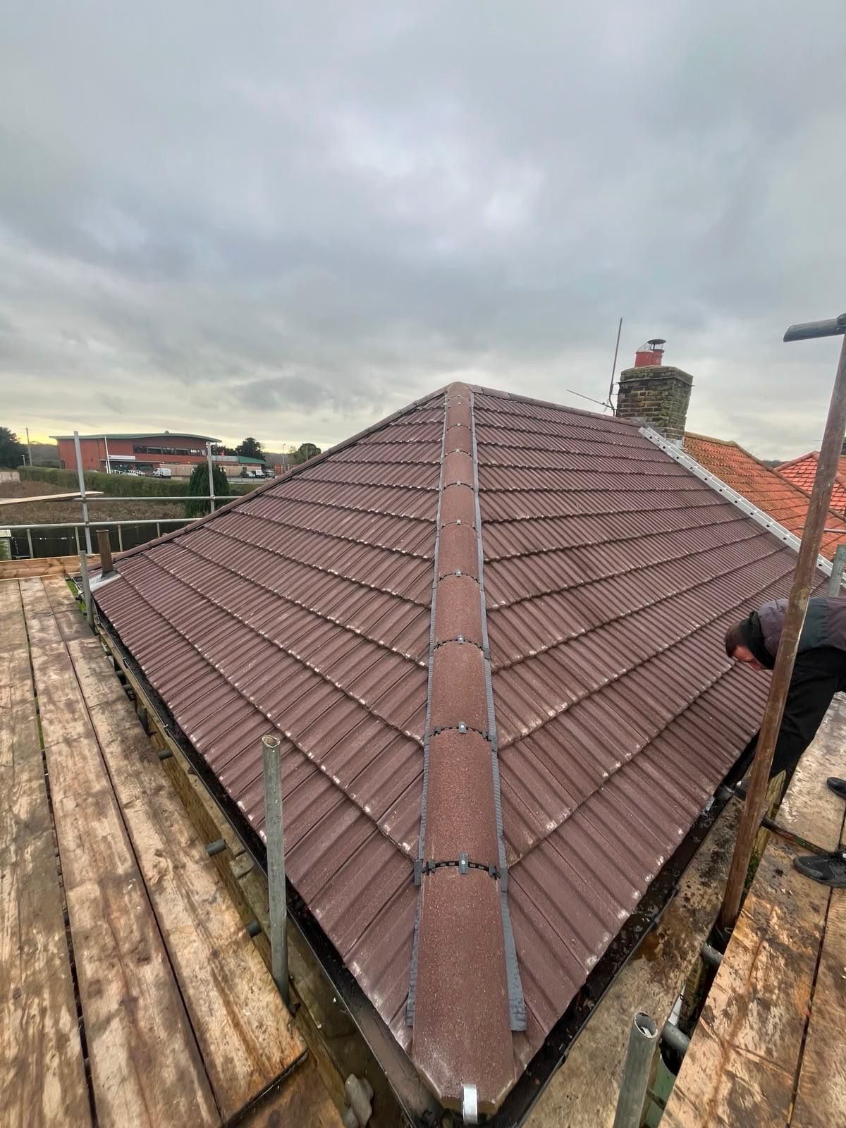 Tiled hip roof with new ridge
