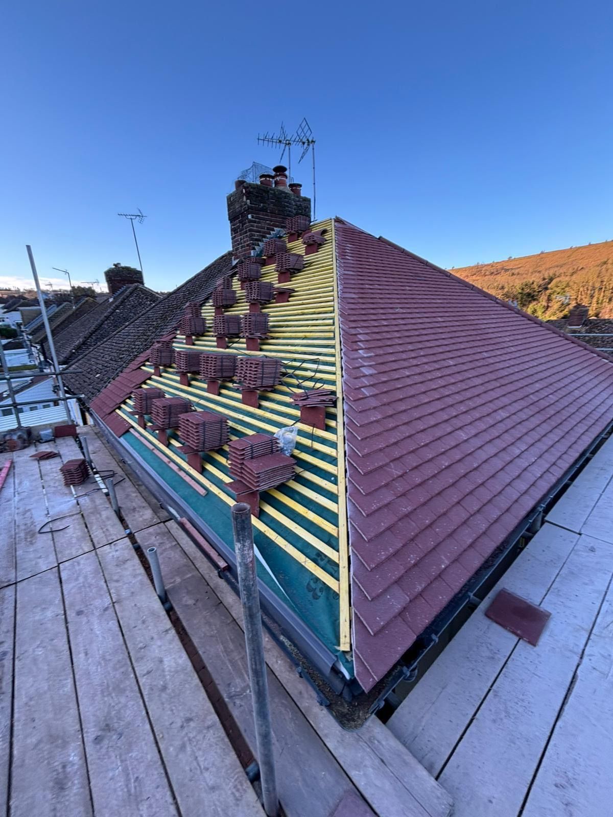 Roof tiles being laid on new battens